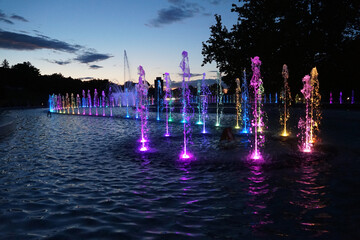 Illuminated night fountains in the center of Warsaw. Poland           