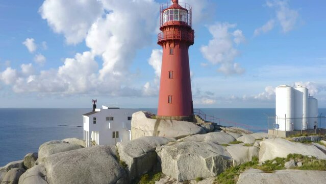 Secluded Island by the Norwegian Coast, low drone flight over Svenner Island and Svenner Lighthouse