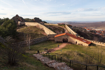 Obraz premium A scenic landscape of the Belogradchik Rocks in Bulgaria with impressive rock formations with amazing light at golden hour in winter. Belogradchik, Bulgaria