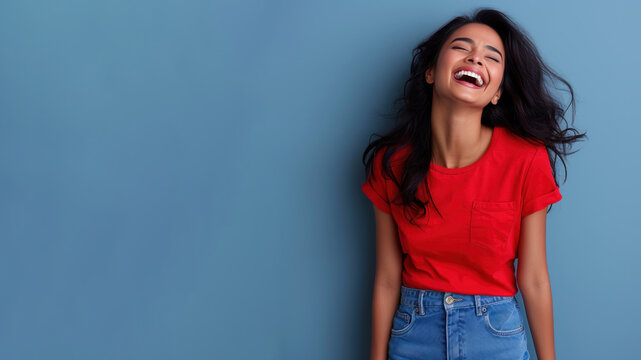 Indian woman wear red t-shirt smile laugh out loud isolated