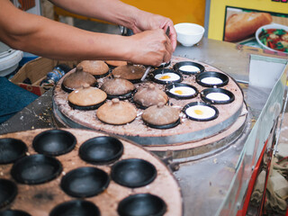 Traditional Vietnamese Mini Pancake. Vietnamese Street Food in Da Lat city, Vietnam. Banh can on...