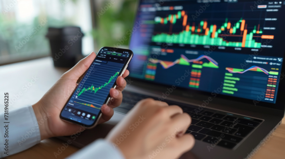 Poster a person is holding a smartphone with stock market data on the screen, with a blurred background sho