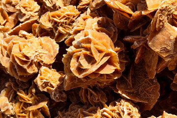 Background. A pile of raw, natural desert roses Tunisia, Africa