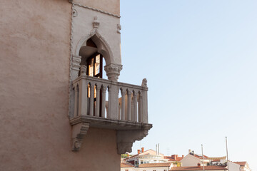 Venetian house. Corner balcony with a stone balustrade, Tartini Square, Piran - 731975072