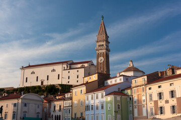 Free standing bell tower of Cathedral of St. Georges between houses, Piran - 731976082
