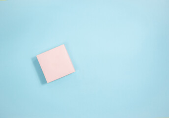 Holiday pink gift box on light pink background. Flat lay. Copy space. Concept of holidays and gifts preparation.