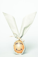 egg wrapped in bunny shaped napkin
