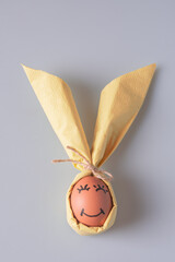 egg wrapped in bunny shaped napkin