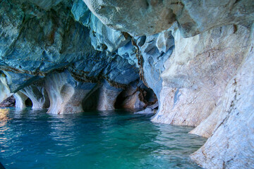 Sculpted blue chapels of  Marble caves or Cuevas de Marmol at turquoise General Cerrerra Lake. Location Puerto Sanchez, Chile