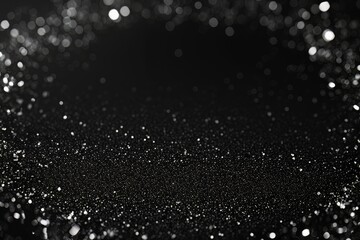 Festive metallic glitter and bokeh black wallpaper background copy space for text