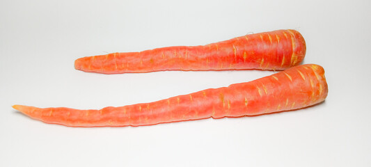 Fresh ripe carrots on white background, side view