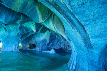 Sculpted blue chapels of  Marble caves or Cuevas de Marmol at turquoise General Cerrerra Lake....