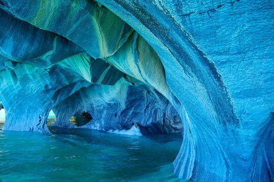 Sculpted blue chapels of  Marble caves or Cuevas de Marmol at turquoise General Cerrerra Lake. Location Puerto Sanchez, Chile