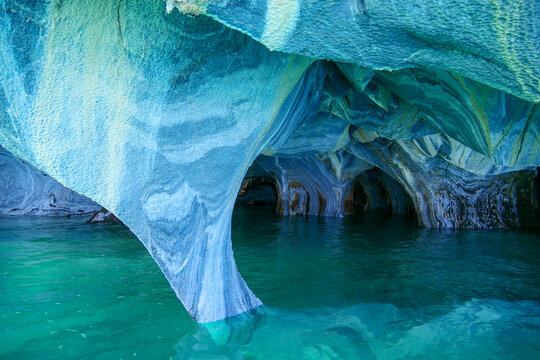 Sculpted blue chapels of  Marble caves or Cuevas de Marmol at turquoise General Cerrerra Lake. Location Puerto Sanchez, Chile