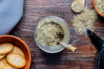 Composition of mate, yerba mate, kettle and cookies. Traditional Argentine breakfast and snack.