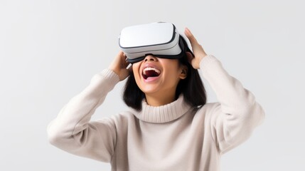Asian woman using a VR glasses, happy Isolated on a white background studio portrait. VR, future, gadgets, technology, education online.