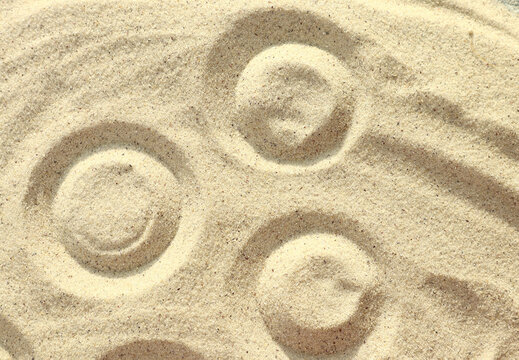 Sand patterns and drawings as background