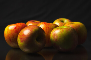 apples on a black background