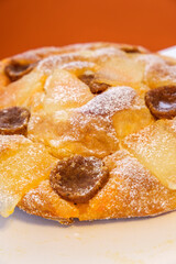 Ensaimada dels Darrers Dies, decorated with sobrassada and pumpkin, typical of the last days before beginning the period of Lent, Mallorca, Spain