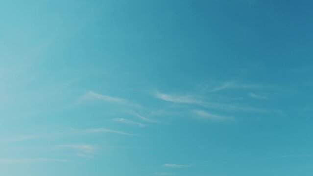 Tropical summer sunlight. Blue sky with cirrus clouds. Fluffy layered cirrus clouds sky atmosphere.