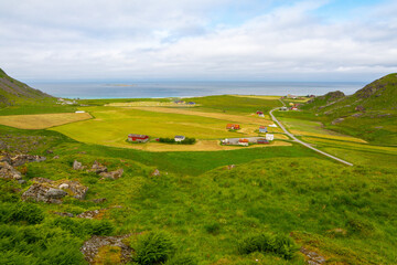Obraz premium View of Uttakleiv beach from the mountain range Veggen on Vestvågøy island, Lofoten islands, Norway. Veggen hike in Lofoten.