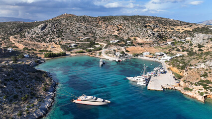 Aerial drone photo of small port of Schoinousa island a safe harbour to yachts and sail boats...