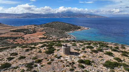 Aerial drone photo of old windmill built uphill in island of Schoinousa, small Cyclades, Greece