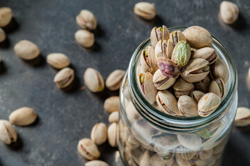 italian pistachios from Sicily in a glass jar studio shot from above