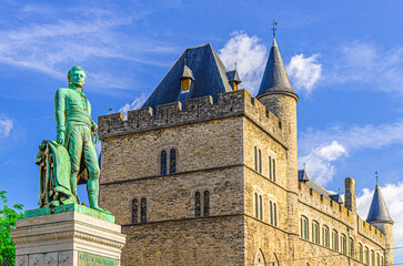 Monument Lieven Bauwens and Castle of Gerald the Devil fortress Geeraard de Duivelsteen background in Ghent city historical center, East Flanders province, Flemish Region, Belgium