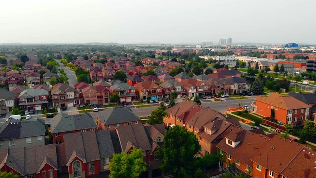 Aerial video for real estate agency: American suburb, showcasing property for sale. Ideal for real estate sales, mortgage property listings, and housing market insights. North American suburban life