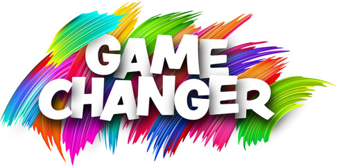 Game changer paper word sign with colorful spectrum paint brush strokes over white.