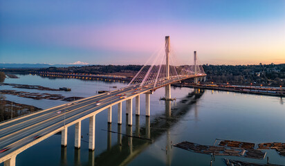 Port Mann Bridge across Fraser River. Sunset Sky.