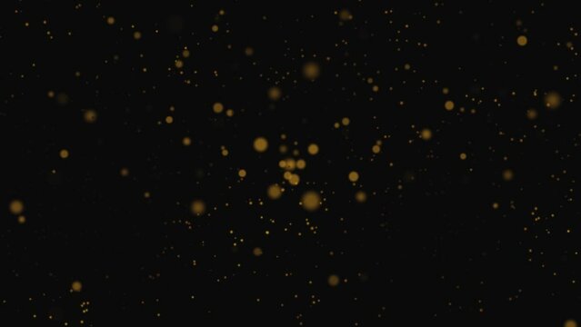 Gold Dust Particles Fly in Slow Motion, Lingering Slowly in the Air. Dust Particles Background with Bokeh Lights on Black Background
