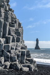 Basalt columns at the base of Reynisfjall cliff in the Reynisfjara beach in southern Iceland cliff