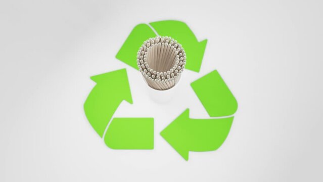 A cup filled with paper straws center within a vibrant green recycling symbol, portraying an eco-responsible choice.