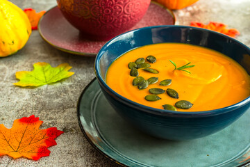 Diet pumpkin soup in a blue bowl