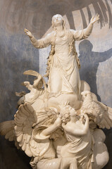 GENOVA, ITALY - MARCH 8, 2023: The marble statue of St. Agnese in the church Chiesa di Nostra Signora del Carmine e Sant Agnese by Nicolo Stefano Traverso (1790).