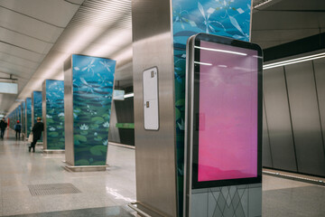An electronic advertising screen at a metro station. Free space.
