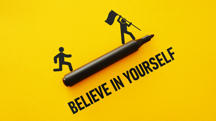 Believe in yourself is shown using the text and picture of running man - obrazy, fototapety, plakaty