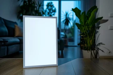 Foto op Plexiglas closeup of a blank picture frame mockup standing in a dark appartement background © Salander Studio