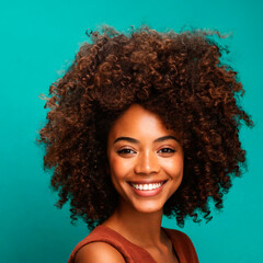 Portrait of a Black woman with afro hair, smiling face