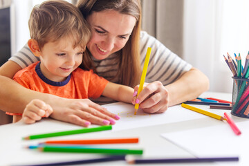 Mother and Son Enjoying Creative Time with Pencils