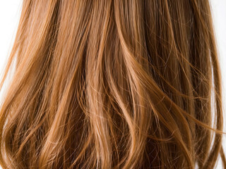 Fototapeta premium Beautiful healthy shiny hair texture. Closeup of long brown hair. Beauty and hair care concept.