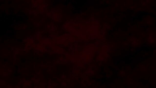 Red Smoke on Black Wall Background: Stock Motion Graphics Video Showing Red Smoke Billowing on a Black Background