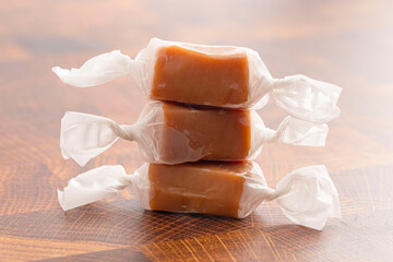 Hand Wrapped Soft Caramel Candies  on a Wood Butcher Block Table