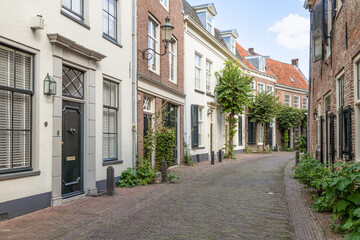 Fototapeta na wymiar Narrow old street with wall houses in the old part of Amersfoort.