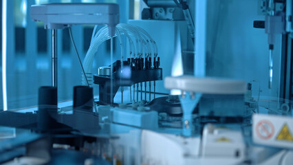 Close up of medical centrifugal machine with test tubes analyzing blood samples. Advanced research...