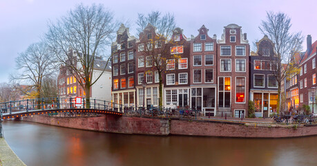 Fototapeta na wymiar Typical houses and bridge at winter Amsterdam canal Brouwersgracht, Holland, Netherlands