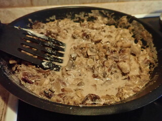 mushroom sauce on a frying pan in kitchen