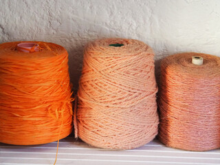 three spools of coral string